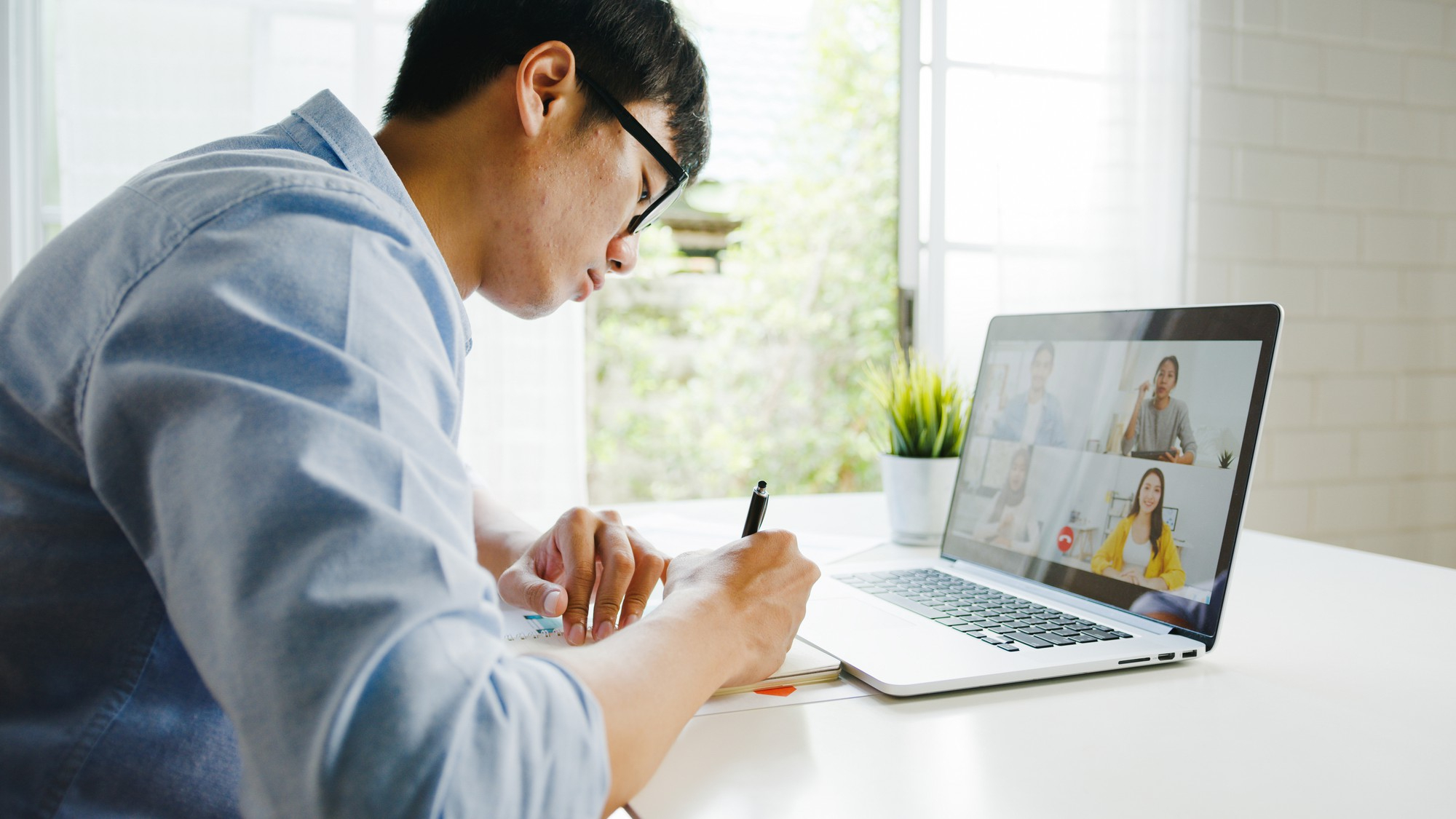 Person learning how to write good meeting minutes