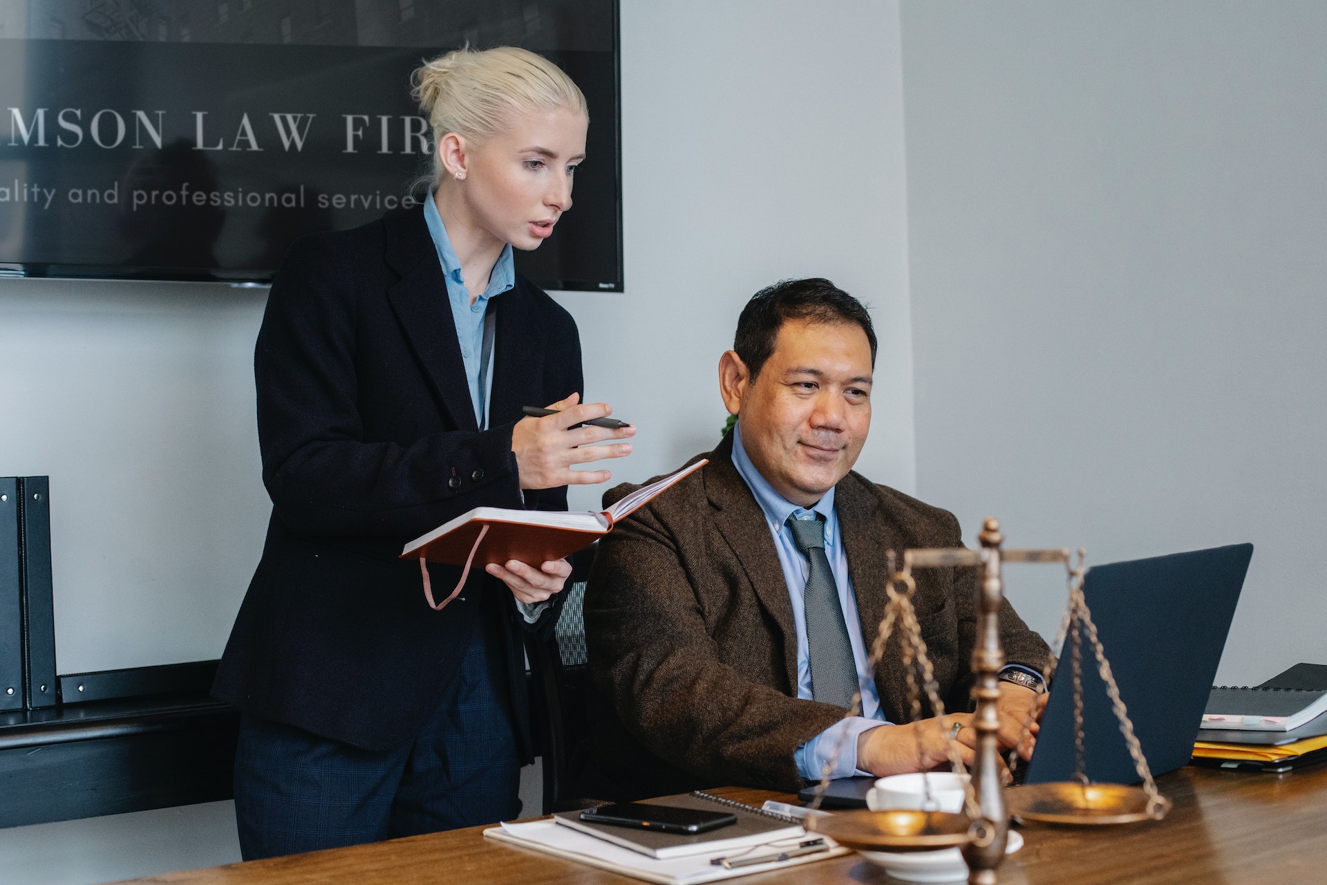 Attorneys researching legal transcription services