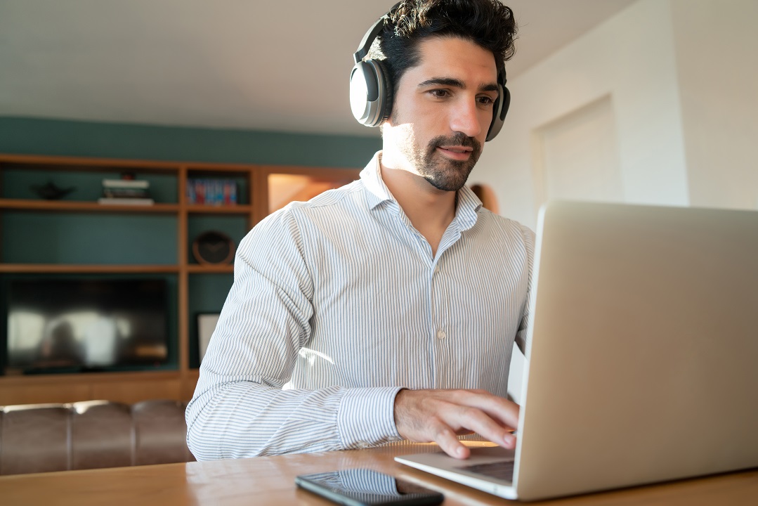 Human transcriptionist creating audio transcript using transcription features